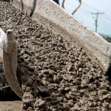 Cement truck pouring concrete